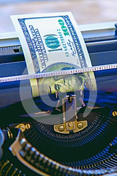 Money being typed out in a manual typewriter as symbol of inflation, global financial crisis and uncertain future of international