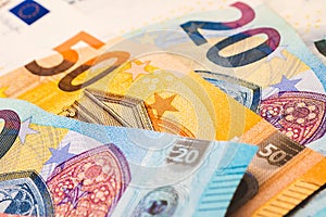 Money bills background. Euro - EUR. Euro banknotes on a table in close-up photography.