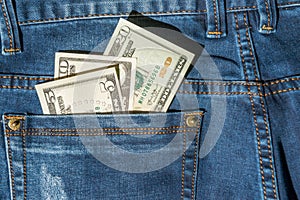 Money in blue jeans pocket