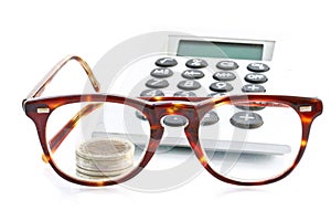 Money, calculator and glasses