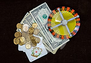 Money cards and roulette on a dark background