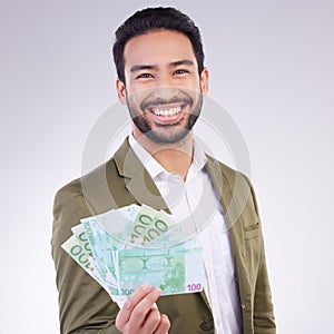 Money, cash and happy man face isolated on a white background business wealth, bonus or investing profit. Winner