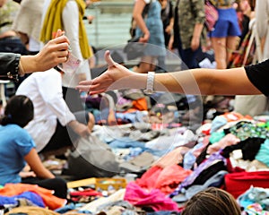 Money changing hands at a suitcase rummage photo