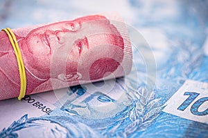 Money from china and brazil, banknotes of one hundred reais and banknotes of 100 yuan, or Renminbi. Brazil and china market