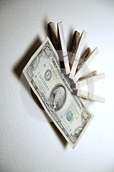 Money clipped with pegs