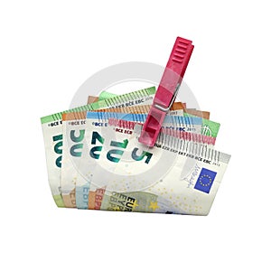 Money on a clothespin. Euro in a clothespin, Home saving.