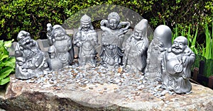 Money coins and Seven lucky gods statues at Daisho-in temple, Miyajima island Japan