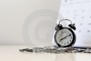 Money coins step with calendar and alarm clock ,Tax time and saving money and financial planning concept