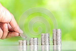 Money Collecting silver coins Adding money Men`s hands are raising money Growing up of business nature background