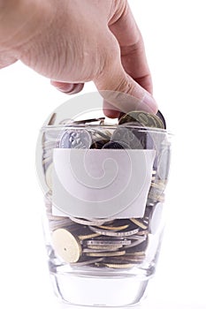 Money concept, coins inside or with the glass isolated over whit