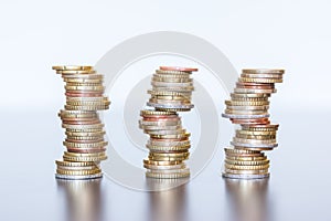 Money concept: Coins tacked on each other. Inflation, currency, savings, money