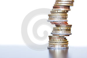 Money concept: Coins tacked on each other. Inflation, currency, savings, money