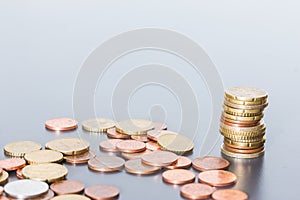 Money concept: Coins tacked on each other. Inflation, currency, savings, money photo