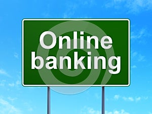 Money concept: Online Banking on road sign background