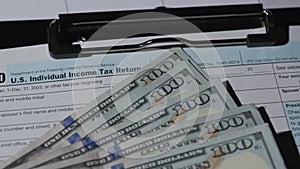 Money currency stack of hundred dollar bills on table