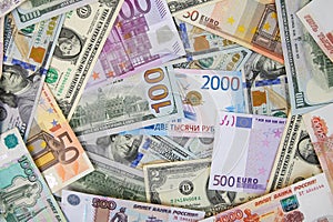 Money from different countries: dollars, euros, rubles.