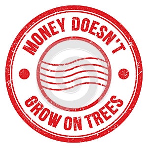 MONEY DOESN`T GROW ON TREES text on red round postal stamp sign photo