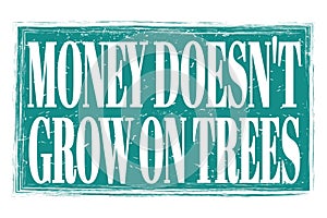 MONEY DOESN`T GROW ON TREES, words on blue grungy stamp sign