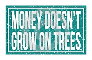 MONEY DOESN`T GROW ON TREES, words on blue rectangle stamp sign photo