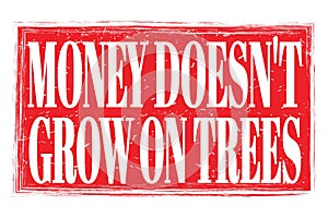 MONEY DOESN`T GROW ON TREES, words on red grungy stamp sign photo