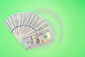 The Money dollar bills on a light green background