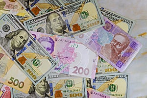 Money dollars and hryvnia, close-up top view concept finance