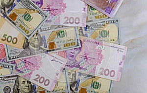 Money dollars and hryvnia, close-up top view concept finance