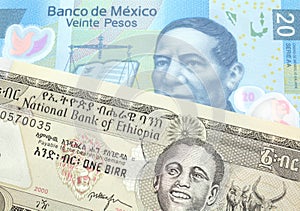 Money from Ethiopia along with money from Mexico close up