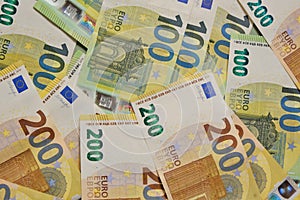 Money. Euro banknotes background.Finance and savings.Two hundred and one hundred euro banknotes.European Union currency