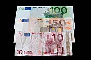 Money Euro banknotes isolated on black for business and finance