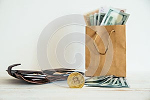 Money euro dollars and bitcoin in package