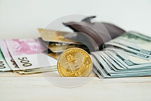 Money euro dollars and bitcoin with wallet and bank cards