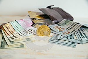 Money euro dollars and bitcoin with wallet and bank cards