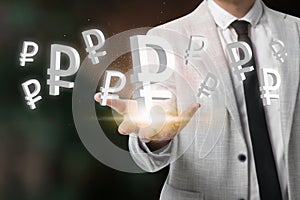 Money exchange concept. Businessman with Russian ruble currency symbols on blurred background, closeup