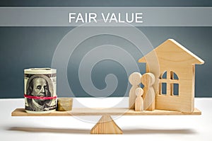 Money and family with a house on the scales with the inscription Fair value. Property valuation. Home appraisal. Housing evaluator