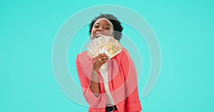 Money, fan and black woman with cash in hand in studio, blue background and winning, prize and rich investor. Finance