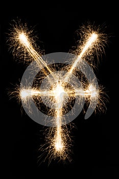 Sparkler yen symbol on black background