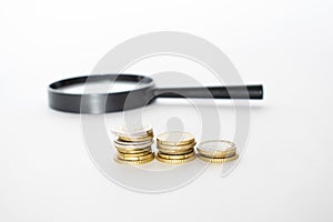 Money, Financial, Business Growth concept, Stack of coins with magnifying glass
