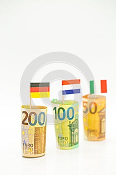 Money and flags of European countries.Flags of Germany, France and Italy euro bills on a white background.euro inflation