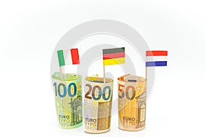 Money and flags of European countries.Flags of Germany, France and Italy euro bills on a white background.euro inflation