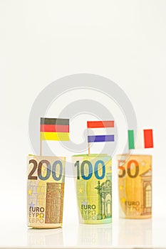 Money and flags of European countries.Flags of Germany, France and Italy euro bills on a white background.euro inflation