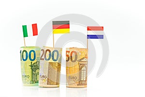 Money and flags of Germany, France and Italy euro bills on a white background.euro inflation.Changes in the budget