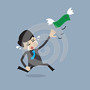 Money is flying away from businessman