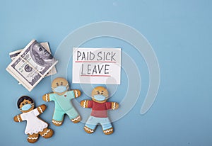 Money and the gingerbread family to mask the inscription of paid sick leave