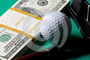 Money golf club and ball