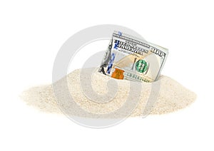Money on heap of sand. Isolated on white