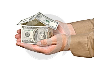 Money house in hands