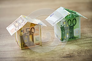 Money houses built of euro banknotes