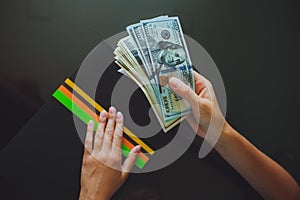 Money in human hands, women giving dollars