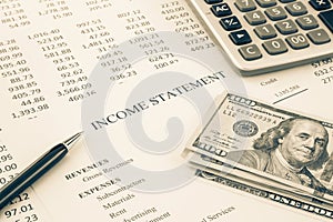 Money and income statement report in sepia tone